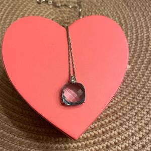 Blue topaz pendant with diamond. Silver chain.